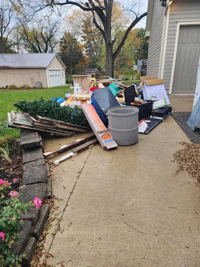 Dumpster being loaded with debris for 30 Yard Dumpster Rental in North Little Rock